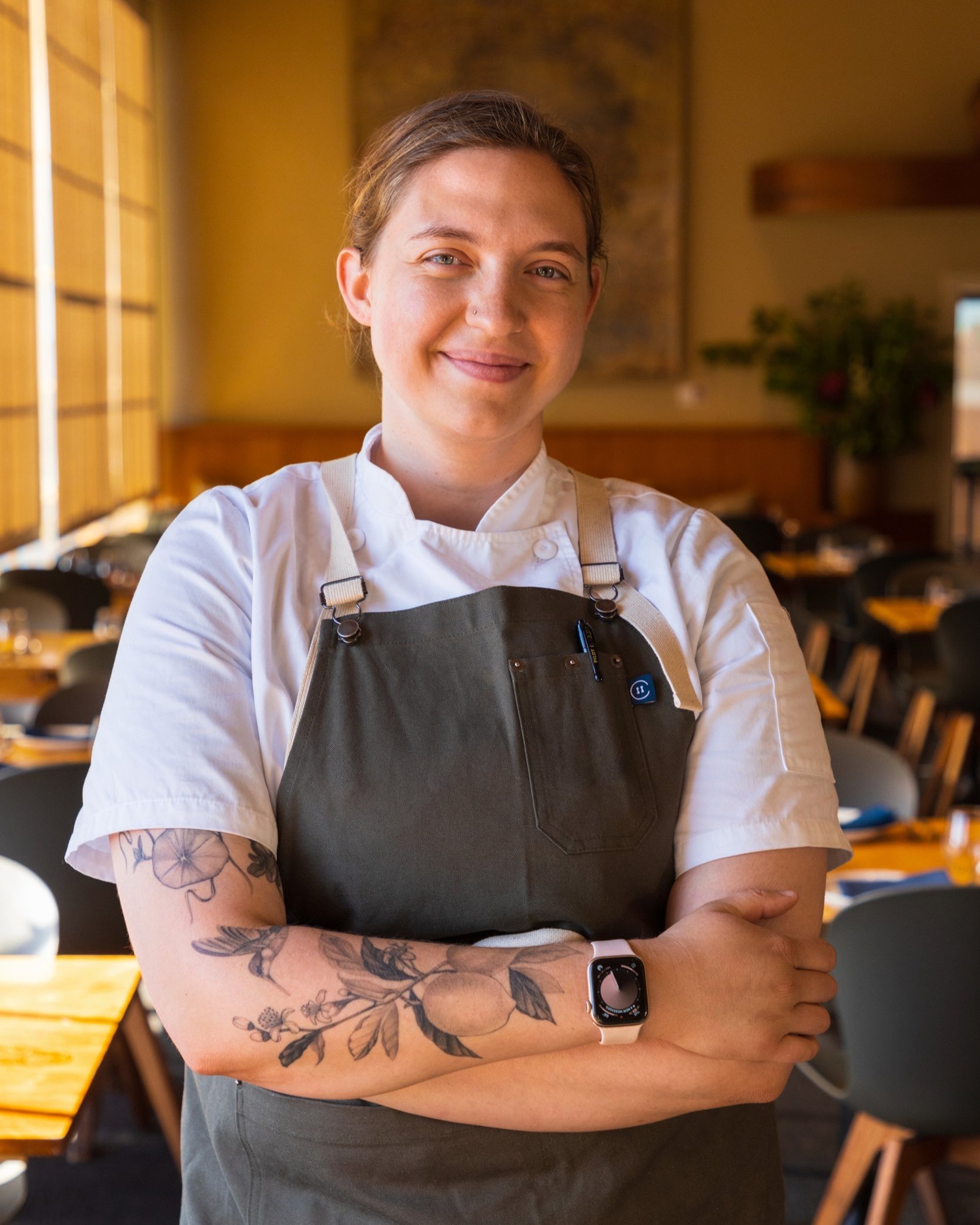 Executive Chef Katie Reicher of Greens Restaurant in San Francisco posing in the main dining room before a chef collaboration dinner with Crystal Wahpepah